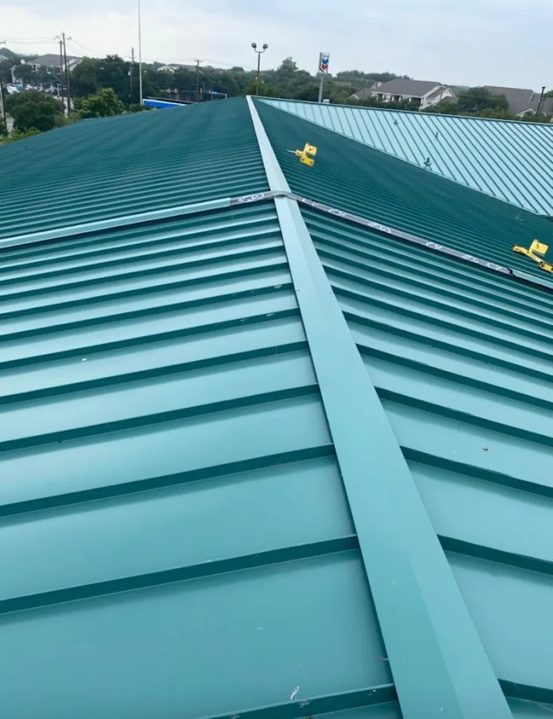 Green commercial metal roof ridge and valley for Metal Roof Repair in St. Johns